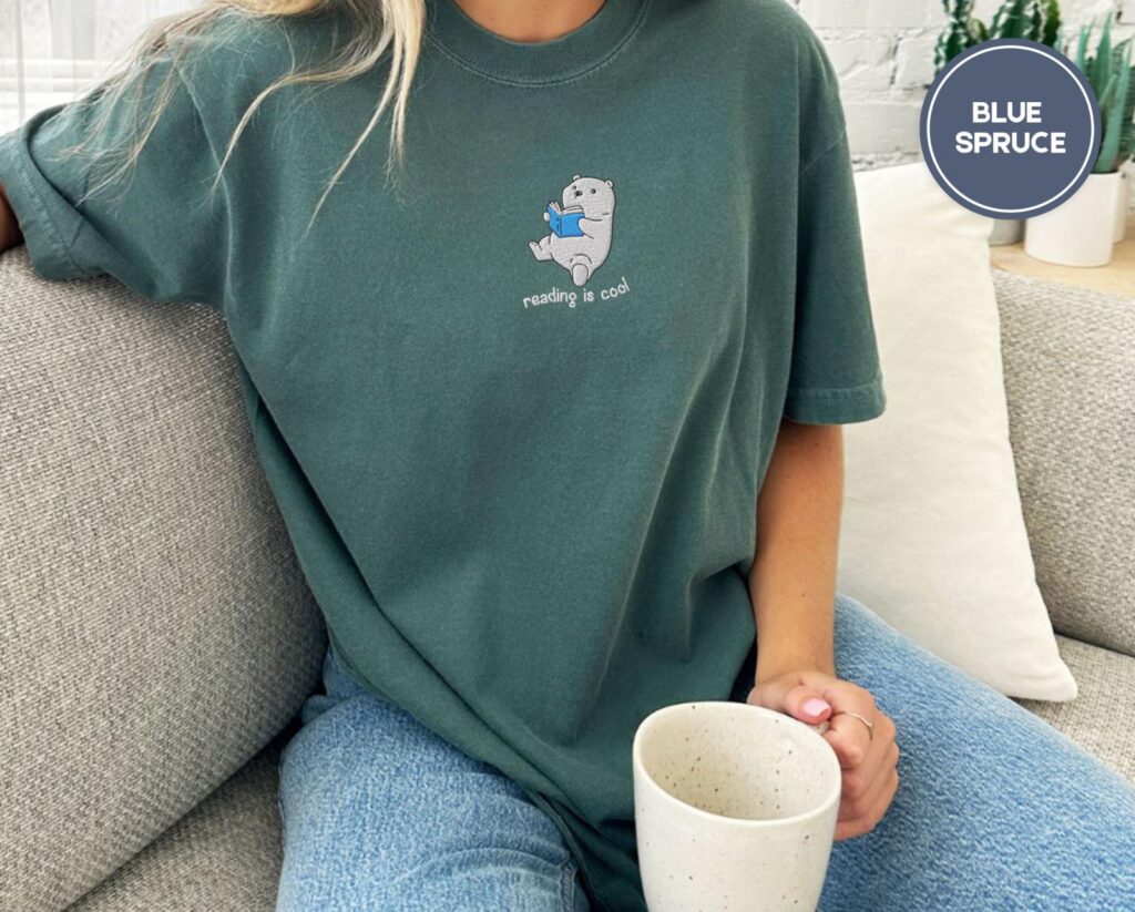 Person wearing a blue spruce Reading Polar Bear Embroidered T-Shirt