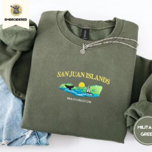 Military Green crewneck sweatshirt embroidered with San Juan Islands, Washington, an orca tail, a sailboat and a setting sun
