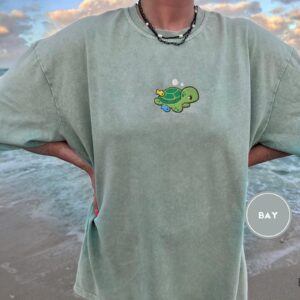 Person wearing a bay Sea Turtle and Fish Embroidered T-Shirt