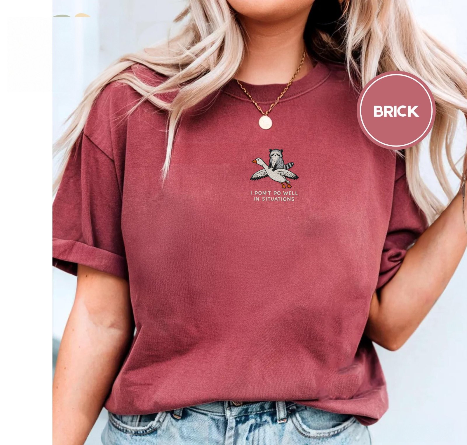 Person wearing a brick Situations Quote Raccoon and Goose Embroidered T-Shirt