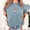 Person wearing an ice blue Spa Duck Embroidered T-Shirt