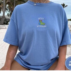 Person wearing a flo blue Spicy Bookworm Embroidered T-Shirt