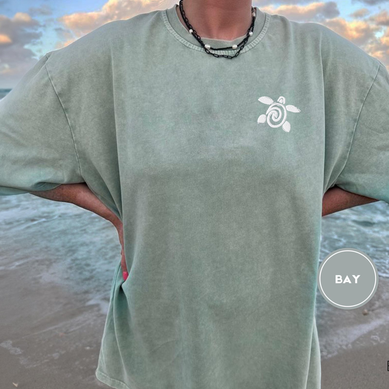 Person wearing a bay Spiral Sea Turtle Embroidered T-Shirt
