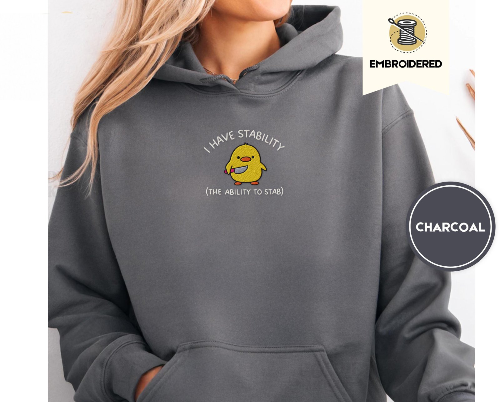 Person wearing a charcoal Stability Duck Embroidered Hoodie