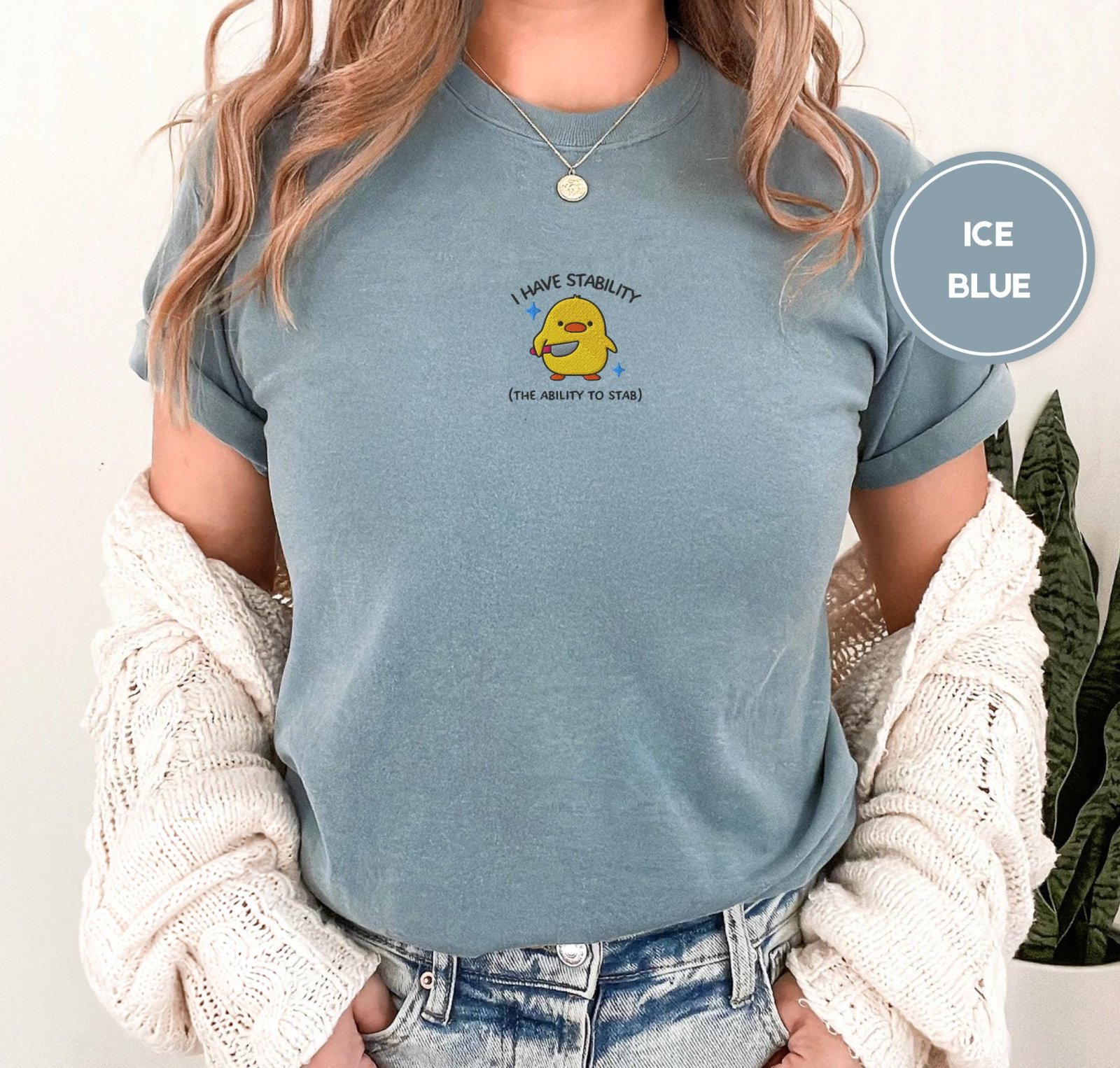 Person wearing an ice blue Stability Duck Embroidered T-Shirt