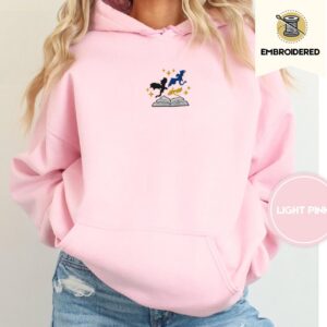 Person wearing a light pink Starry Three Dragons Embroidered Hoodie