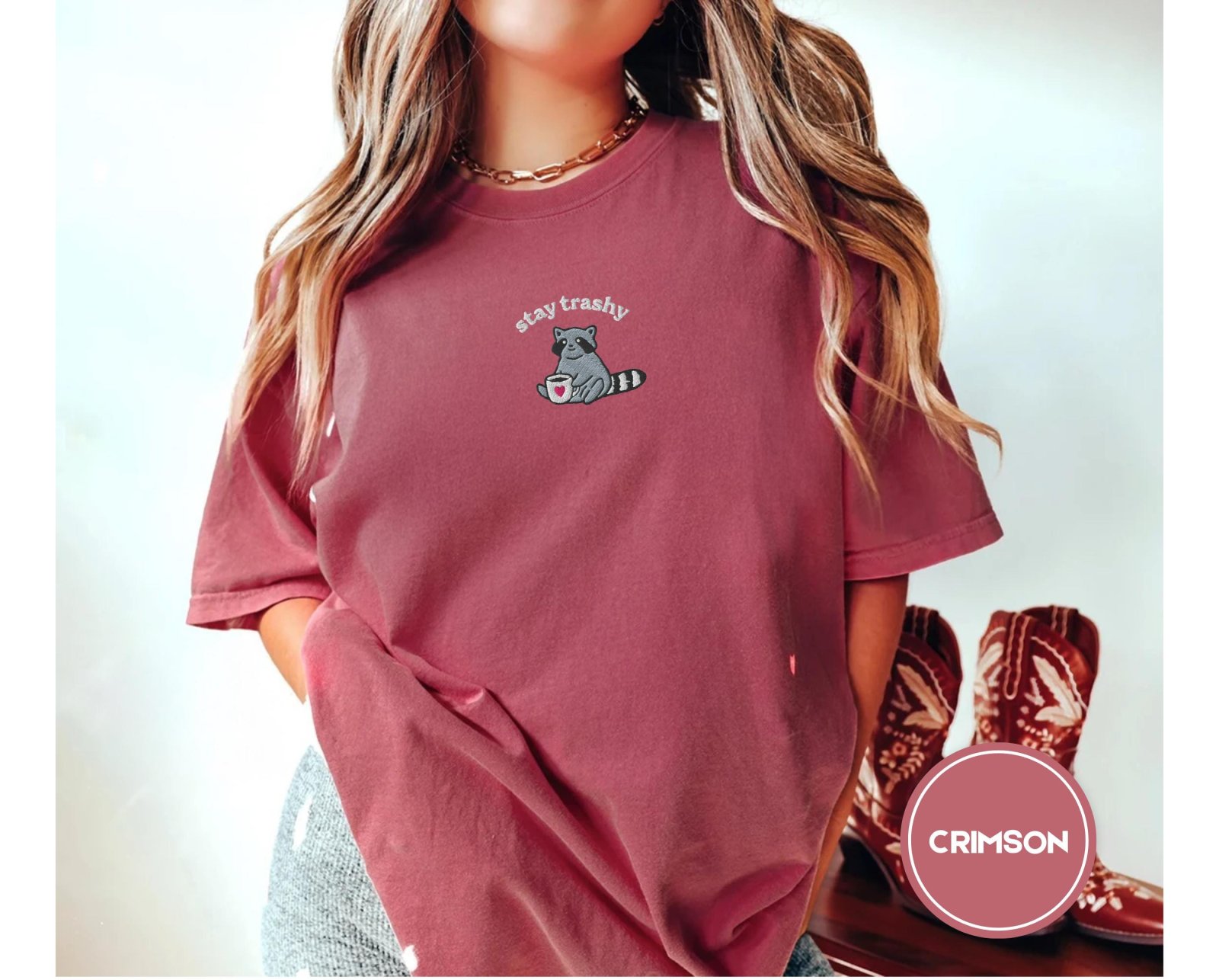 Person wearing a crimson Stay Trashy Raccoon Embroidered T-Shirt