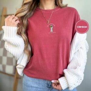 Person wearing a crimson Sunglasses Goose Embroidered T-Shirt