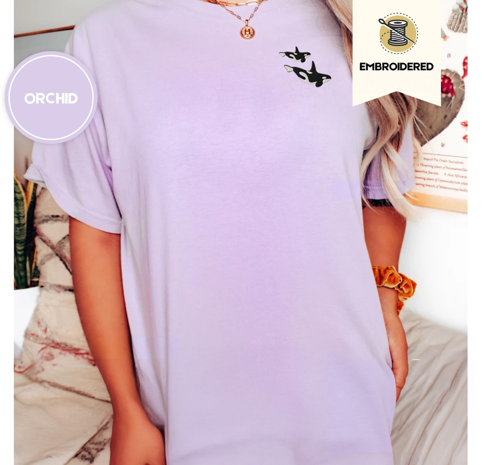 Person wearing an orchid Swimming Orca Whales Embroidered T-Shirt