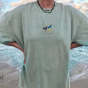 Person wearing a bay Three Dragons and Golden Stars Embroidered T-Shirt