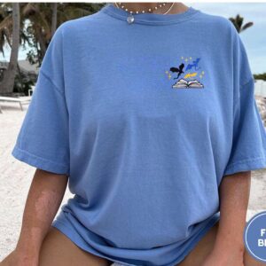 Person wearing a flo blue Three Dragons and Stars Embroidered T-Shirt