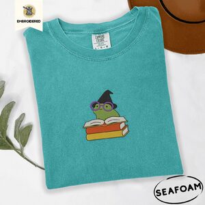 Seafoam Witchy Frog and Books Embroidered T-Shirt