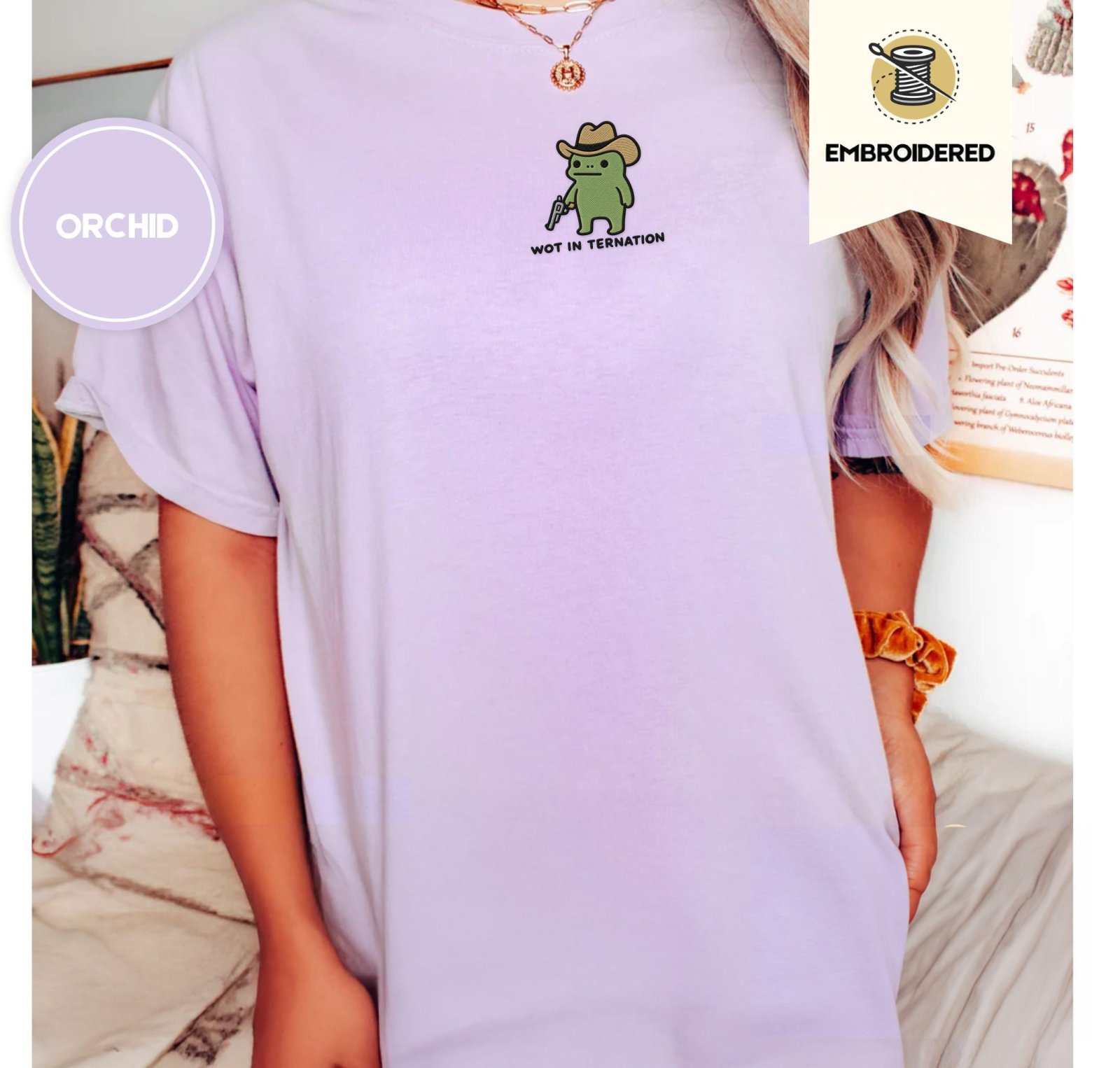 Person wearing an orchid Wot in Tarnation Cowboy Frog Embroidered T-Shirt