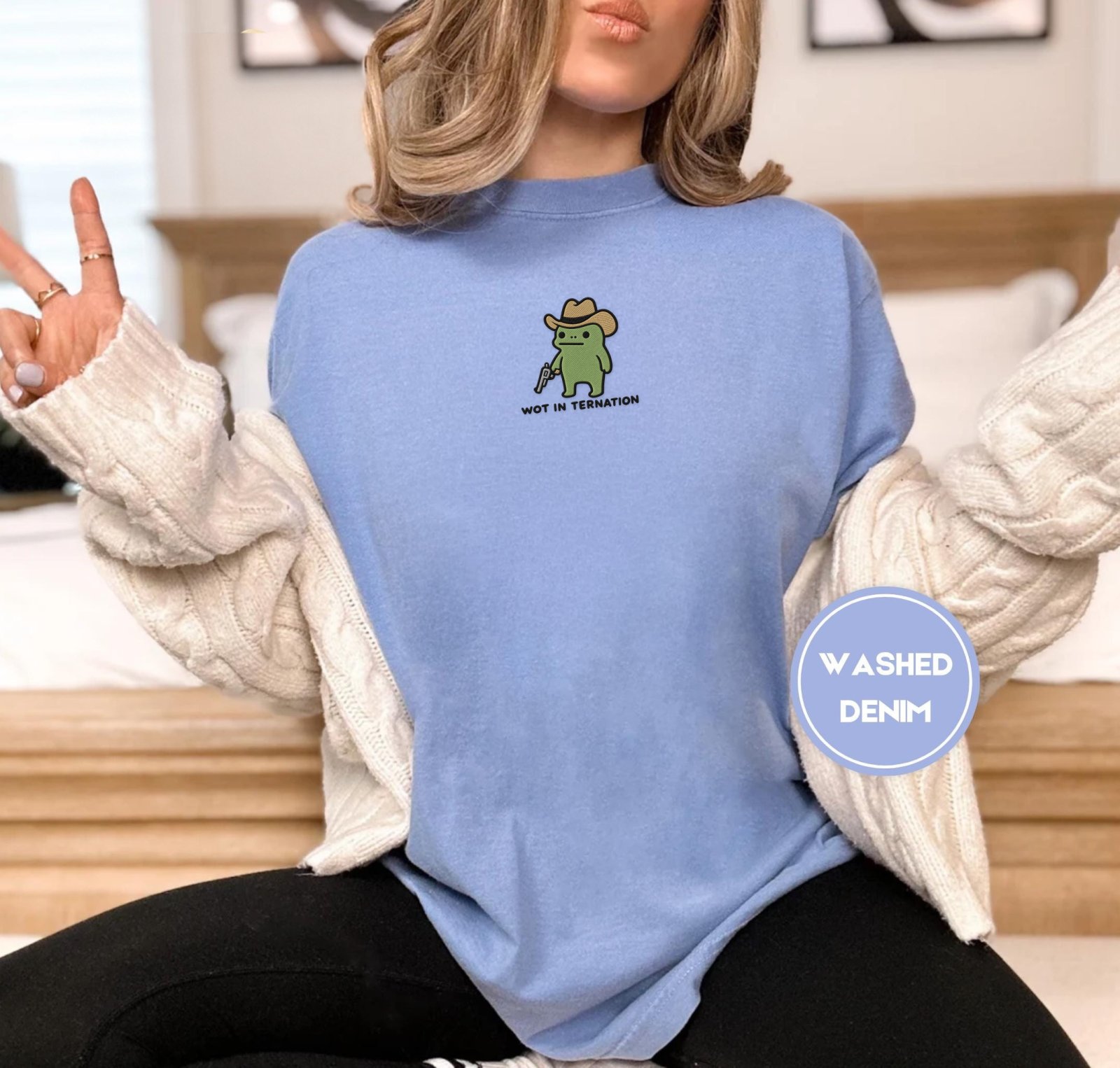 Person wearing a washed denim Wot in Tarnation Cowboy Frog Embroidered T-Shirt