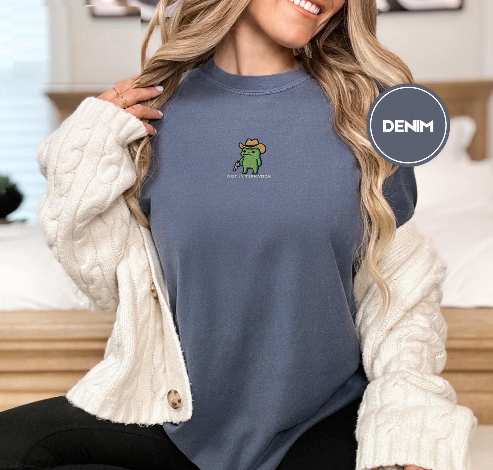 Person wearing a denim Wot in Ternation Cowboy Frog Embroidered T-Shirt